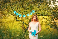 Pregnant woman in a white dress royalty free stock images Pregnant woman in a white dress royalty free stock images