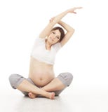 Pregnant Woman Yoga Exercising. Pregnancy Prenatal Health Care