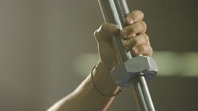 Preparing to bench press. Hands in chalk. With a barbell preparing different view. Vertically framed shot of an athletic stock image Preparing to bench press. Hands in chalk. With a barbell preparing different view. Vertically framed shot of an athletic stock image