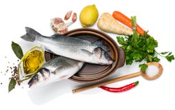 Preparing to cook sea bass fishes, view from above stock photos Preparing to cook sea bass fishes, view from above stock photos