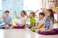Preschool children on speech therapy lesson in kindergarten