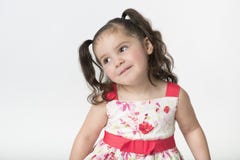 Preschool girl with cute expression looking away stock photo Preschool girl with cute expression looking away stock photo