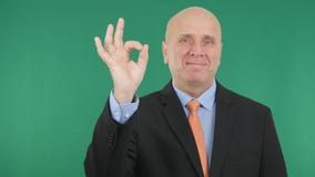 Presentable Manager Smile and Make OK Hand Gestures stock photography Presentable Manager Smile and Make OK Hand Gestures stock photography