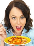 Pretty Attractive Young Woman Ready to Eat a Delicious Plate of Ravioli Pasta stock images Pretty Attractive Young Woman Ready to Eat a Delicious Plate of Ravioli Pasta stock images