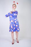 Pretty blonde girl with short hair wearing christmas funny bright dress on white studio background alone stock image Pretty blonde girl with short hair wearing christmas funny bright dress on white studio background alone stock image