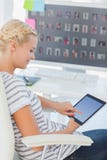 Pretty blonde photo editor working on a tablet computer royalty free stock photo Pretty blonde photo editor working on a tablet computer royalty free stock photo