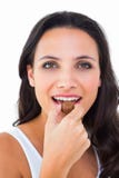 Pretty brunette eating chocolate candy stock photos Pretty brunette eating chocolate candy stock photos