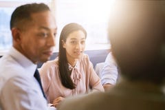 Pretty business woman paying attention during early morning meeting royalty free stock photo Pretty business woman paying attention during early morning meeting royalty free stock photo
