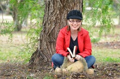 Pretty happy young woman laughing outdoors under tree royalty free stock photo Pretty happy young woman laughing outdoors under tree royalty free stock photo