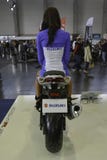 Pretty hostess sitting on a motorcycle royalty free stock photography Pretty hostess sitting on a motorcycle royalty free stock photography