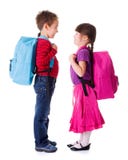 Pretty little schoolgirl and schoolboy Stock Images Pretty little schoolgirl and schoolboy Stock Images