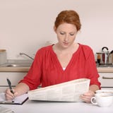 Pretty Red-haired Woman Searching For Job Royalty Free Stock Photography Pretty Red-haired Woman Searching For Job Royalty Free Stock Photography