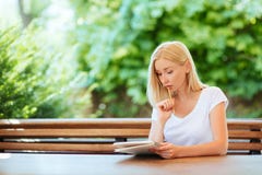 Pretty smiling young woman drawing a sketches. stock photo Pretty smiling young woman drawing a sketches. stock photo