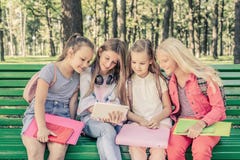 Pretty Smilng Little Girls Sitting Together Stock Image Pretty Smilng Little Girls Sitting Together Stock Image