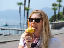 Pretty Summer Girl Eating Ice Cream Outdoors Royalty Free Stock Photos