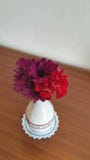Violets in a small vase on the table stock image Violets in a small vase on the table stock image