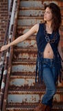 Pretty Woman in Fringed Vest Stock Photo Pretty Woman in Fringed Vest Stock Photo