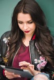 Pretty women using tablet, outdoor portrait, internet, text, touch screen, close up pretty young girl posing in the royalty free stock images Pretty women using tablet, outdoor portrait, internet, text, touch screen, close up pretty young girl posing in the royalty free stock images