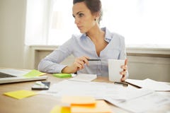 Pretty young female working at home stock photos Pretty young female working at home stock photos