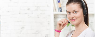 Pretty young smiling woman with a headset royalty free stock photos Pretty young smiling woman with a headset royalty free stock photos