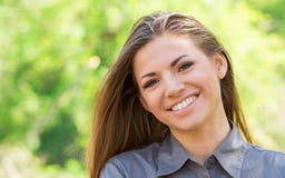 Charming young woman smiling outdoors stock photos Charming young woman smiling outdoors stock photos