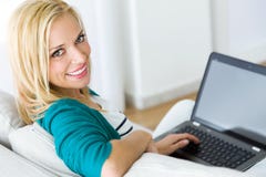 Pretty Young Woman Working With Laptop At Home. Stock Image