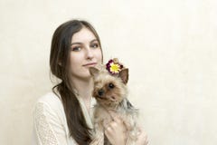 Girl sitting and holding a yorkshire terrier stock photo Girl sitting and holding a yorkshire terrier stock photo