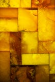 Primer del mosaico ambarino de oro como fondo o textura gema Foto de archivo libre de regalías Primer del mosaico ambarino de oro como fondo o textura gema Foto de archivo libre de regalías