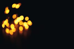 Priorità bassa Defocused di natale dell'estratto dell'oro Bokeh un po'nell'angolo fotografia stock Priorità bassa Defocused di natale dell'estratto dell'oro Bokeh un po'nell'angolo fotografia stock