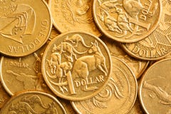 Priorità bassa dell'australiano lle monete dell'un dollaro fotografia stock Priorità bassa dell'australiano lle monete dell'un dollaro fotografia stock