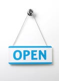 Process blue open door sign on a silver chain on a