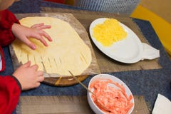 Process of cooking pizza by children in the master class royalty free stock photography Process of cooking pizza by children in the master class royalty free stock photography