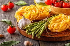 Products for cooking - fresh asparagus, pasta, olive oil. Stock Photos Products for cooking - fresh asparagus, pasta, olive oil. Stock Photos