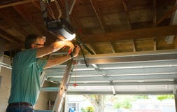 Professional Automatic Garage Door Opener Repair Service Technician Man Working Royalty Free Stock Photos Professional Automatic Garage Door Opener Repair Service Technician Man Working Royalty Free Stock Photos