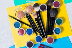 Professional cosmetics on a bright yellow background, top view, close-up, visage stock image Professional cosmetics on a bright yellow background, top view, close-up, visage stock image