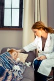Professional female doctor sitting near her patient royalty free stock photos Professional female doctor sitting near her patient royalty free stock photos