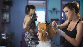 Professional hair color salon. Pretty and smiling girl came to her stylist stock video Professional hair color salon. Pretty and smiling girl came to her stylist stock video