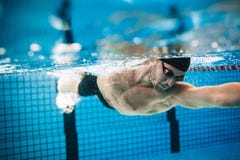 Professional male athlete swimming in pool royalty free stock images Professional male athlete swimming in pool royalty free stock images