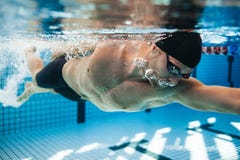 Professional male swimmer swimming in pool royalty free stock photo Professional male swimmer swimming in pool royalty free stock photo