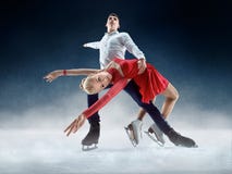 Professional man and woman figure skaters performing on ice show stock photo Professional man and woman figure skaters performing on ice show stock photo