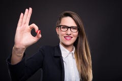 Professional young manager doing ok hand sign. After finishing project with success Stock Images Professional young manager doing ok hand sign. After finishing project with success Stock Images