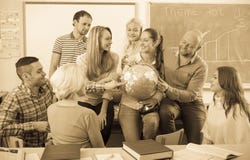 Professor consulting different age students stock image Professor consulting different age students stock image