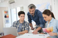 Professor with students at school royalty free stock image Professor with students at school royalty free stock image