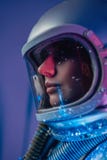 Profile shot of spacewoman inside room with abstract light