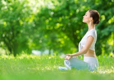 Profile of sportive woman in lotus position zen gesturing Royalty Free Stock Images Profile of sportive woman in lotus position zen gesturing Royalty Free Stock Images