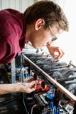Programmer configures hardware for bitcoin mining stock photos Programmer configures hardware for bitcoin mining stock photos