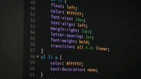 Programmer scrolling up and down for editing page of html css website code editor stock footage Programmer scrolling up and down for editing page of html css website code editor stock footage