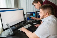Programmers are watching the bitcoin exchange rate royalty free stock photos Programmers are watching the bitcoin exchange rate royalty free stock photos