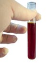 Provetta e mano in laboratorio su bianco immagine stock libera da diritti Provetta e mano in laboratorio su bianco immagine stock libera da diritti