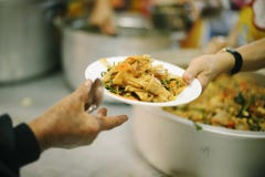 Providing food to the poor is helping sharing from fellow humans together : Concept of famine and social inequality royalty free stock photography Providing food to the poor is helping sharing from fellow humans together : Concept of famine and social inequality royalty free stock photography